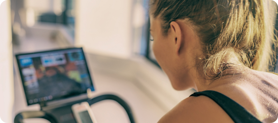 Connected fitness woman on treadmill with ai workout plan