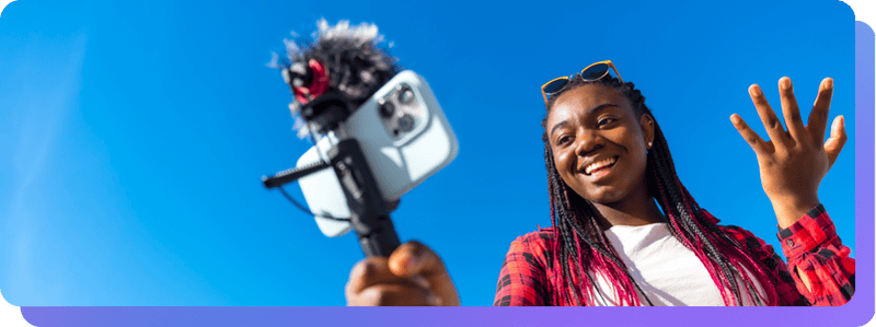 Content creator with camera outside Feed Clips