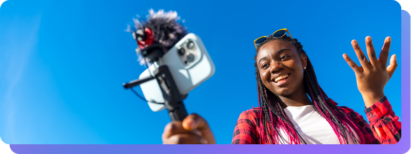 Content creator with camera outside Feed Clips