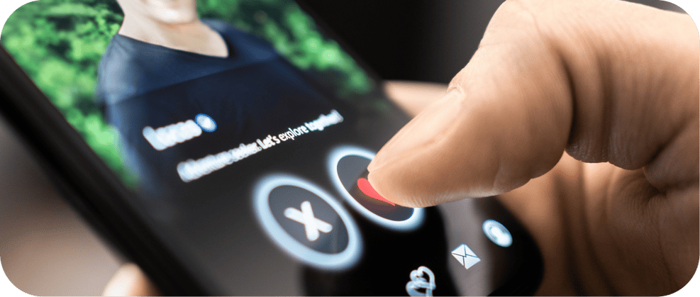 Close-up of a finger tapping the like button on a dating app profile, swiping right on a mobile dating platform.