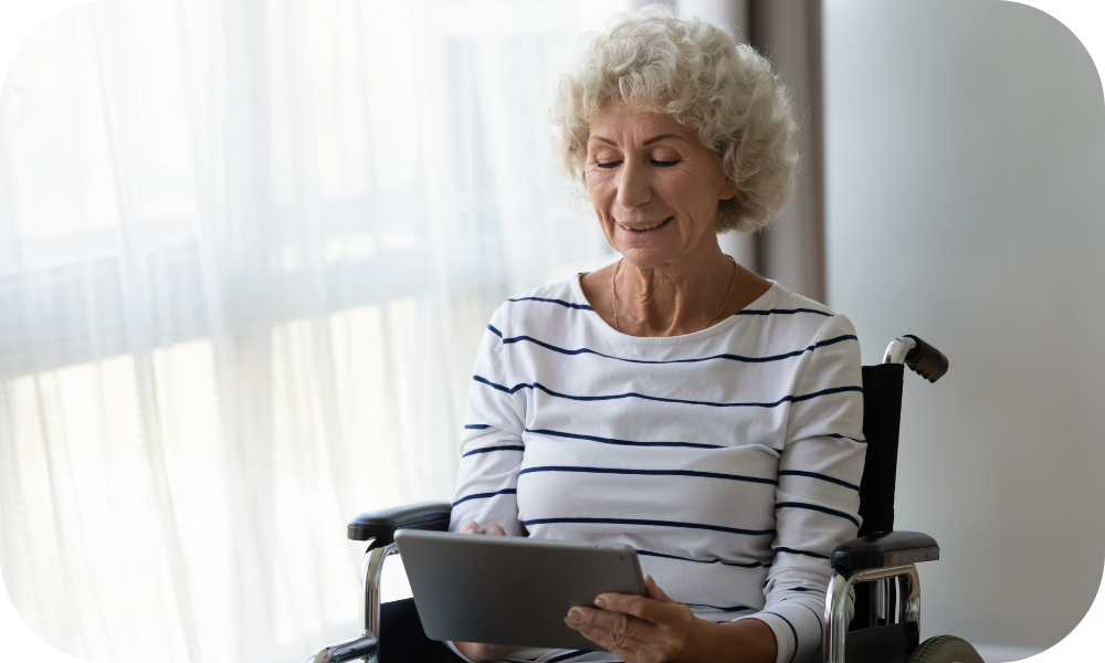 Woman in wheelchair using tablet for physical therapy app