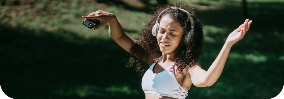 Woman rocking out to favorite music on headphones (1)