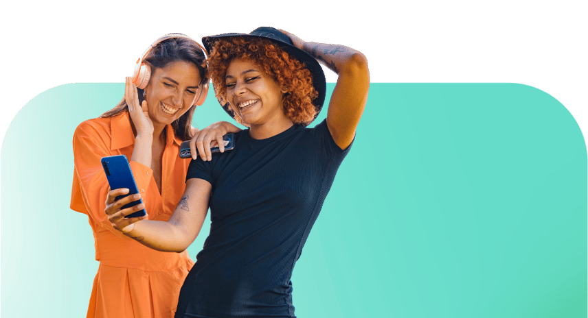 Women sharing phone listening to music on social media app