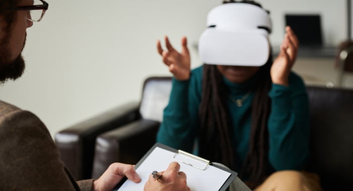 man with vr headset in therapy